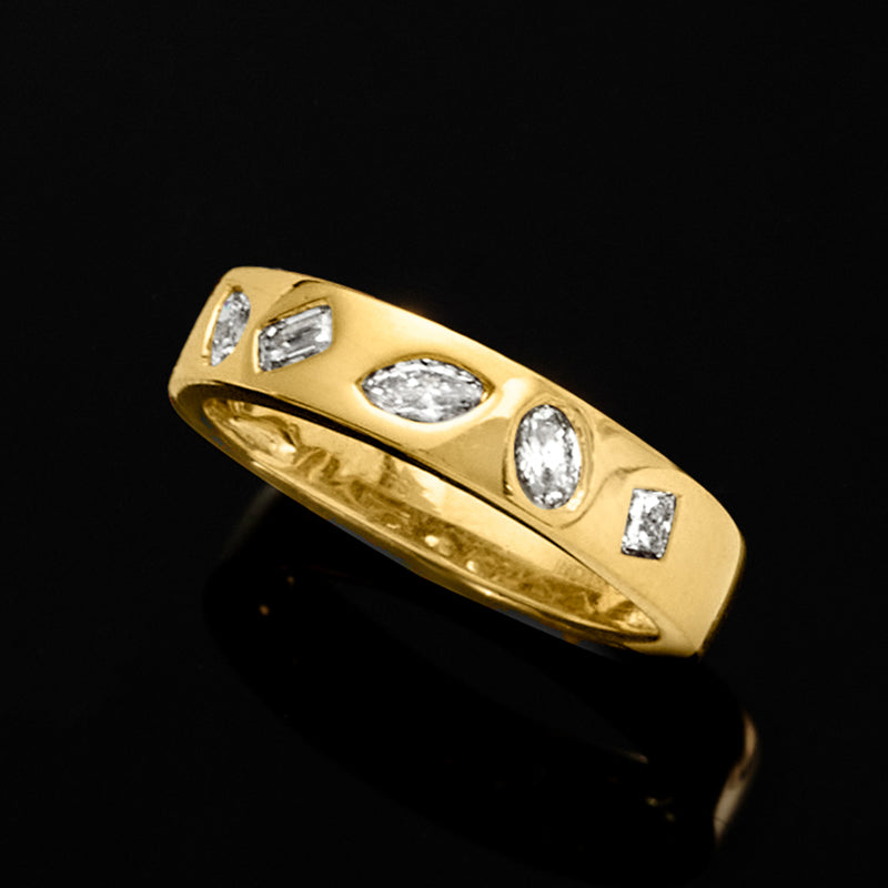 Gold over sterling diamond band ring featuring oval and round stones in bezel settings