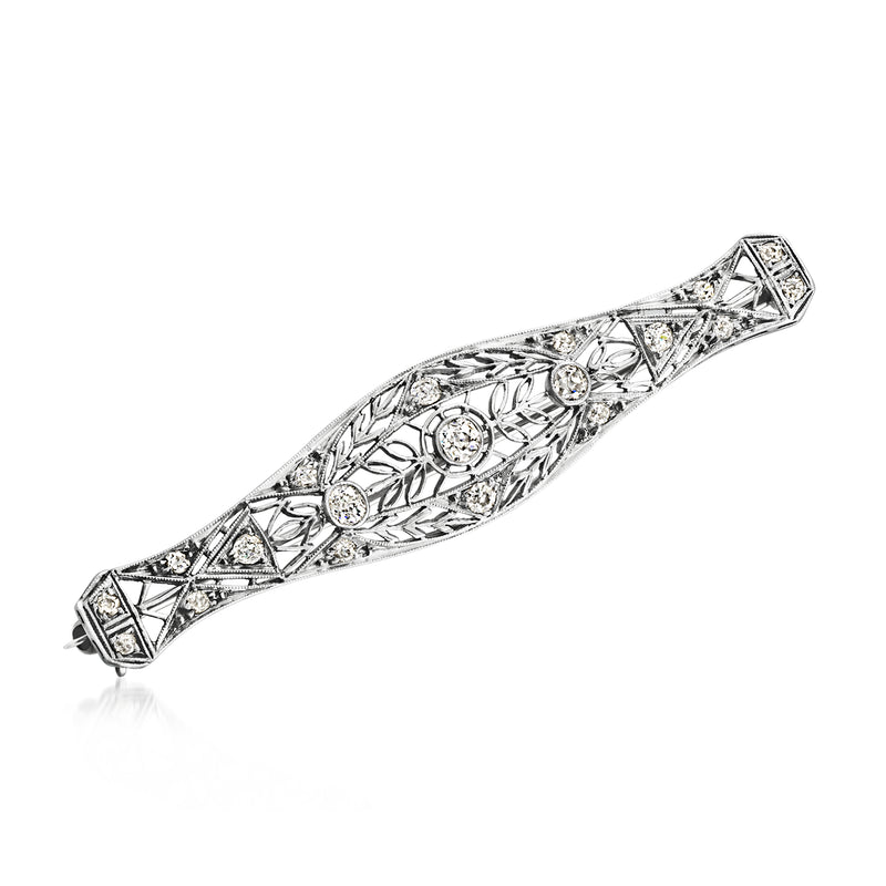 Vintage platinum diamond bar pin with geometric filigree and round stones