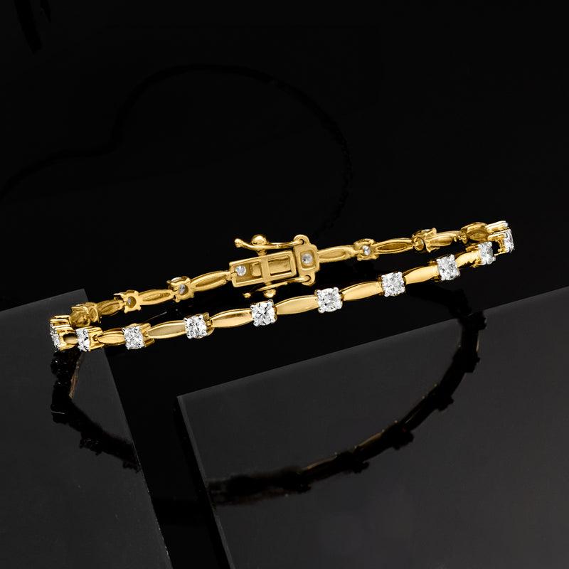 Gold link station bracelet with central square-set diamond and round side stones