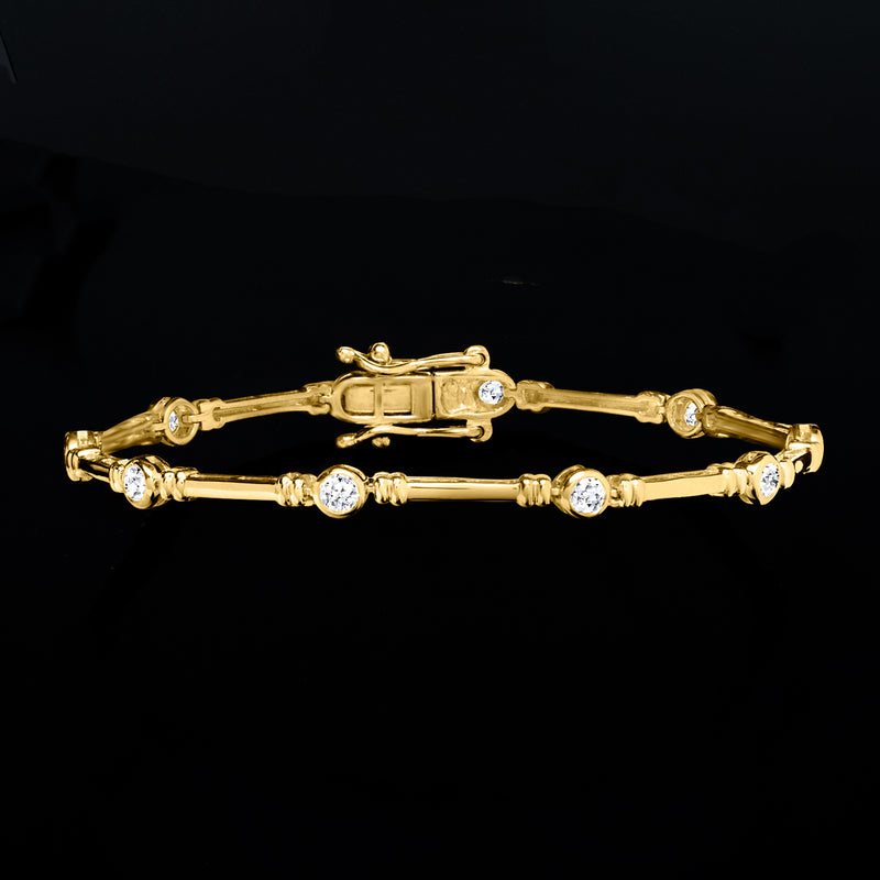 Gold bracelet with round bezel-set diamonds along bar links and box clasp