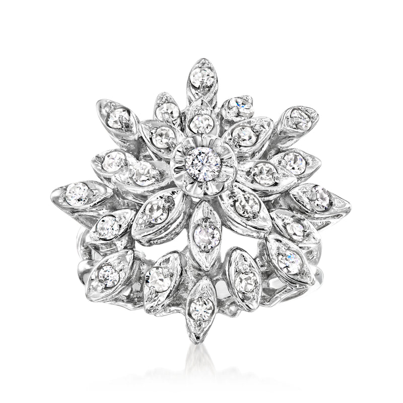White gold vintage diamond cluster ring with round and oval stones, scalloped petals