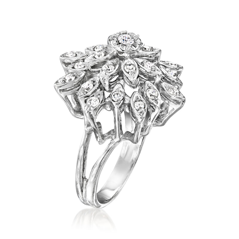 White gold diamond cluster ring, side view with prong-set round center stone