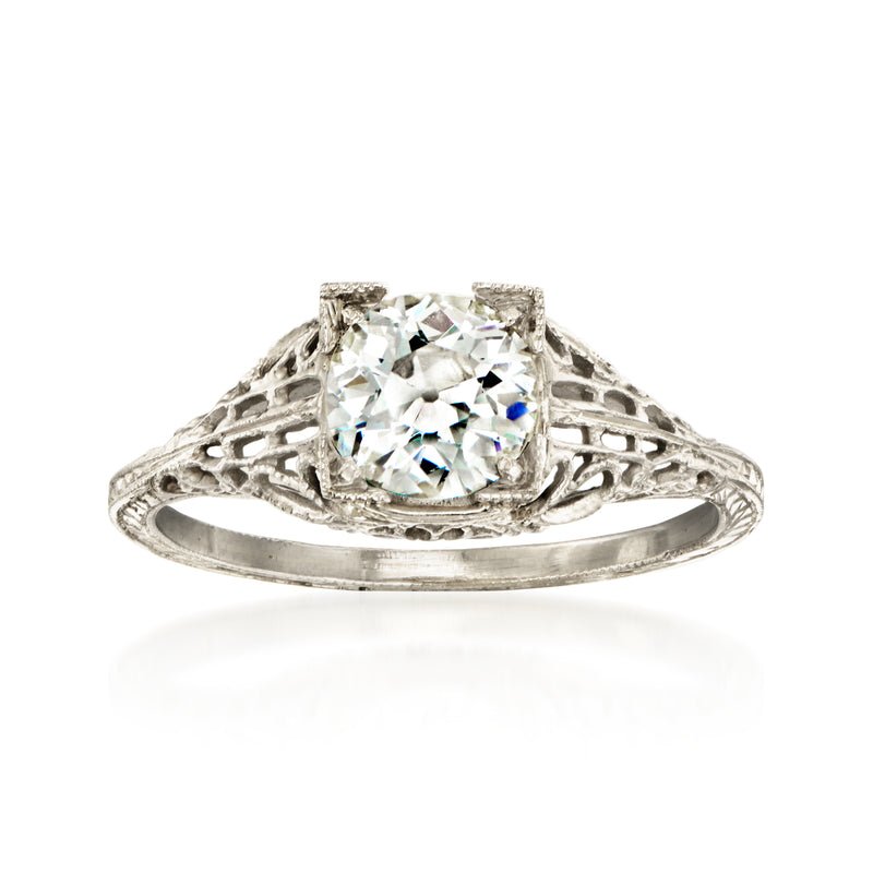 Vintage filigree diamond ring in white gold, round center stone, openwork band