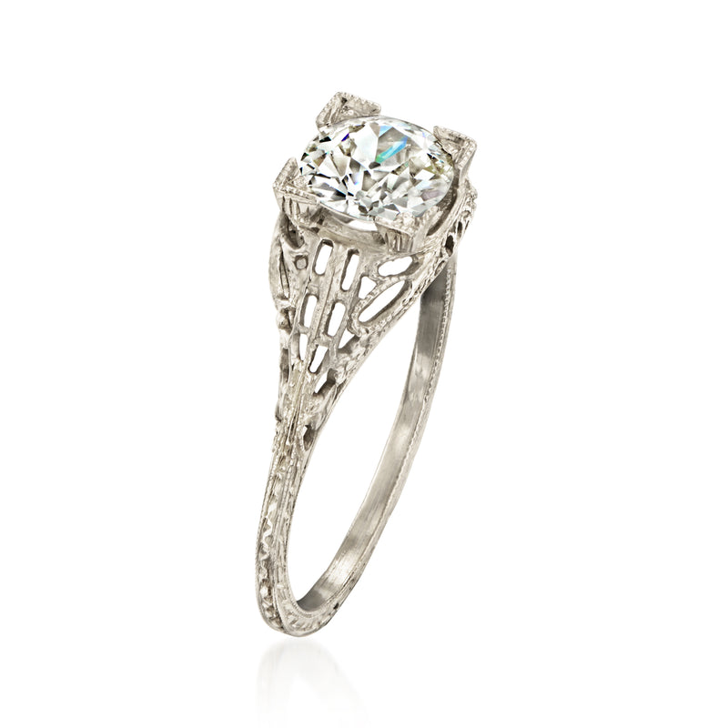 Vintage filigree diamond ring with round center stone and lattice sides, white gold