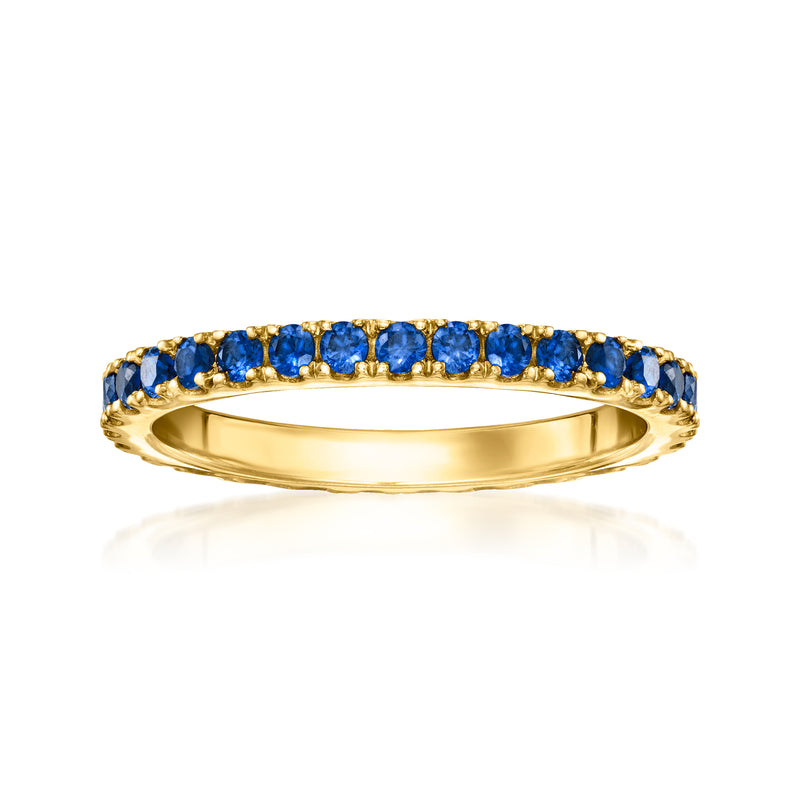 Gold eternity band with blue sapphire stones all around the top