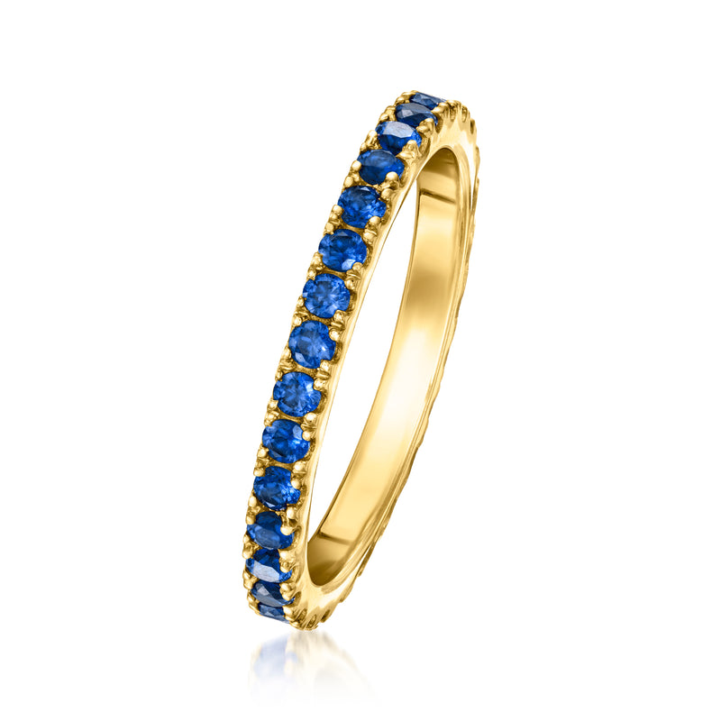 Gold sapphire eternity band in a channel setting along the band