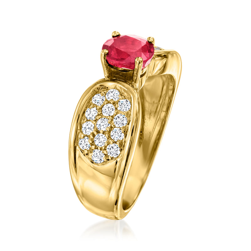 18k yellow gold ring with raised oval red ruby center and oval diamond cluster side setting