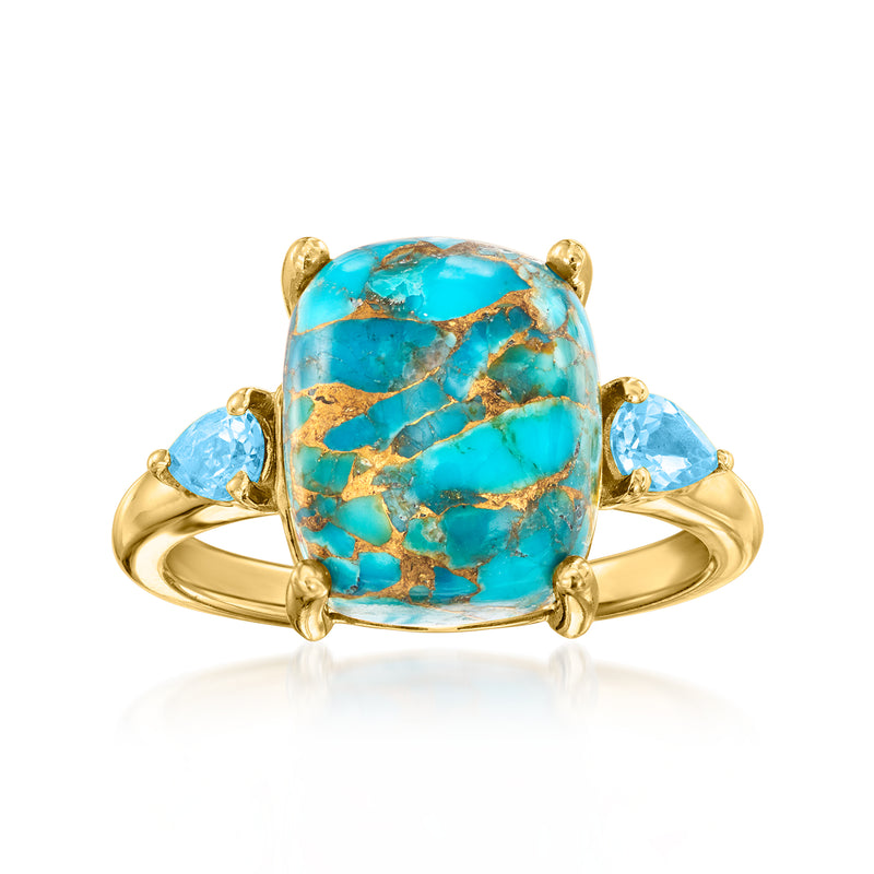 Turquoise oval gemstone ring with gold prongs and two light blue side stones