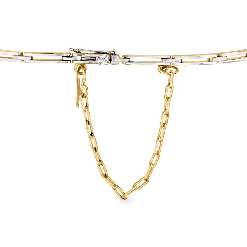 Link bracelet clasp with hanging gold-toned chain and small clear stone accents