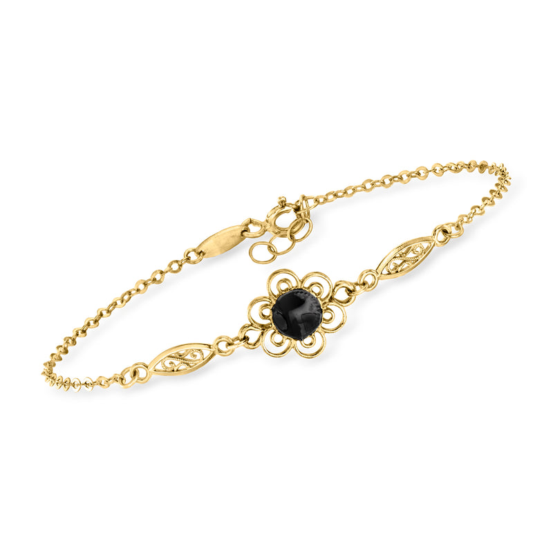 14kt yellow gold bracelet with black enamel flower center and oval link accents