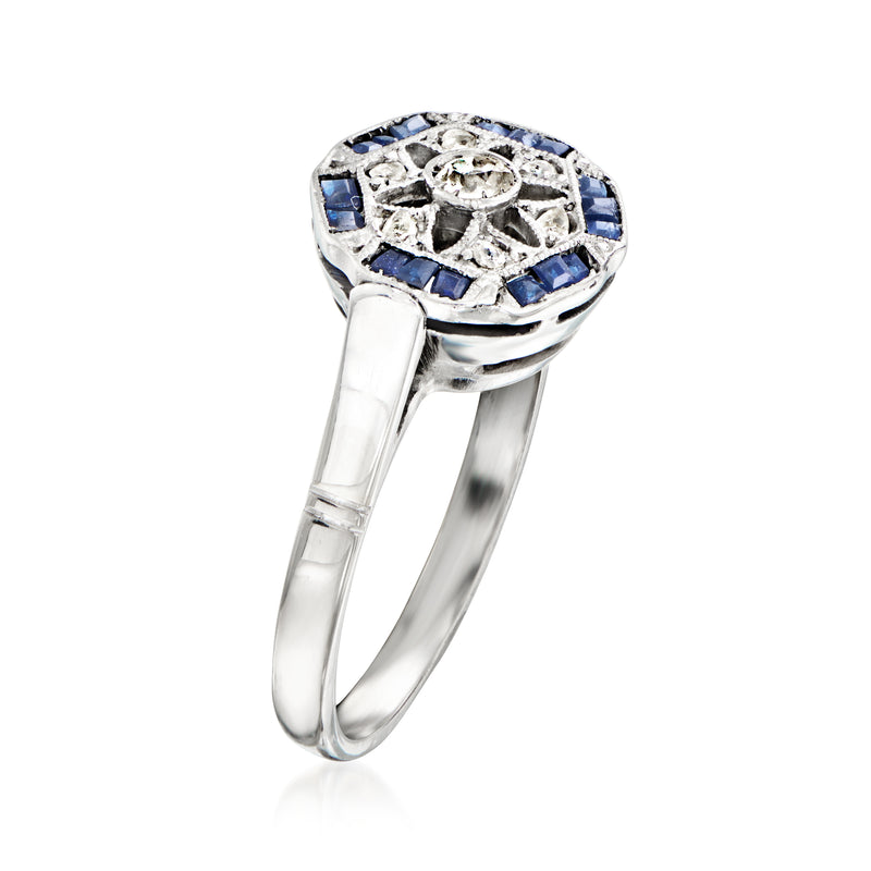 Vintage white gold ring with blue sapphire side panels and central round diamond