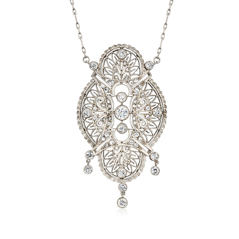 Platinum and white gold diamond filigree pendant necklace with oval ornate setting