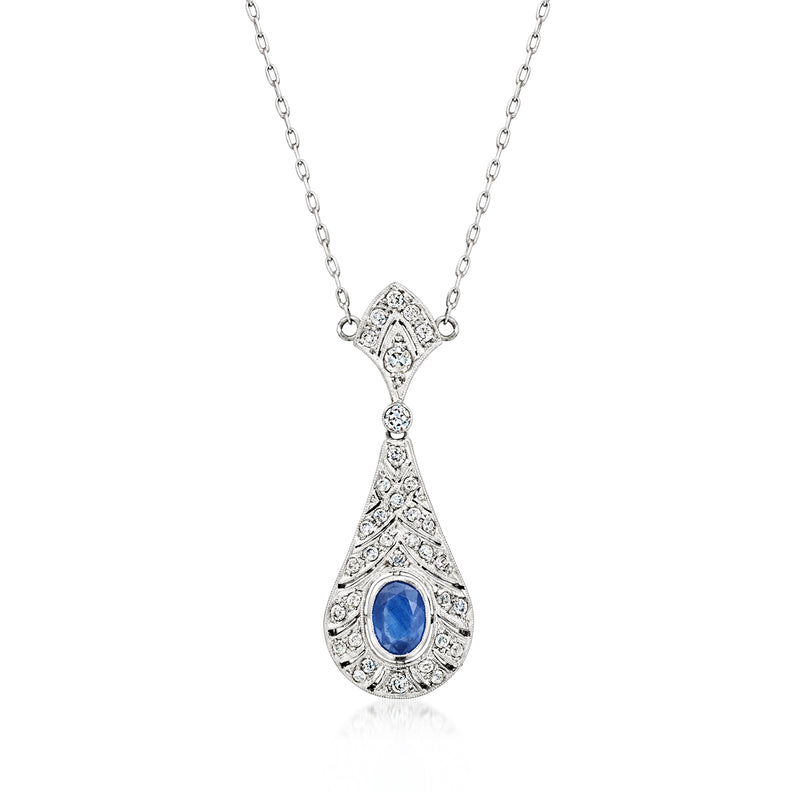 Platinum pendant necklace with teardrop design, blue sapphire center and diamond accents.