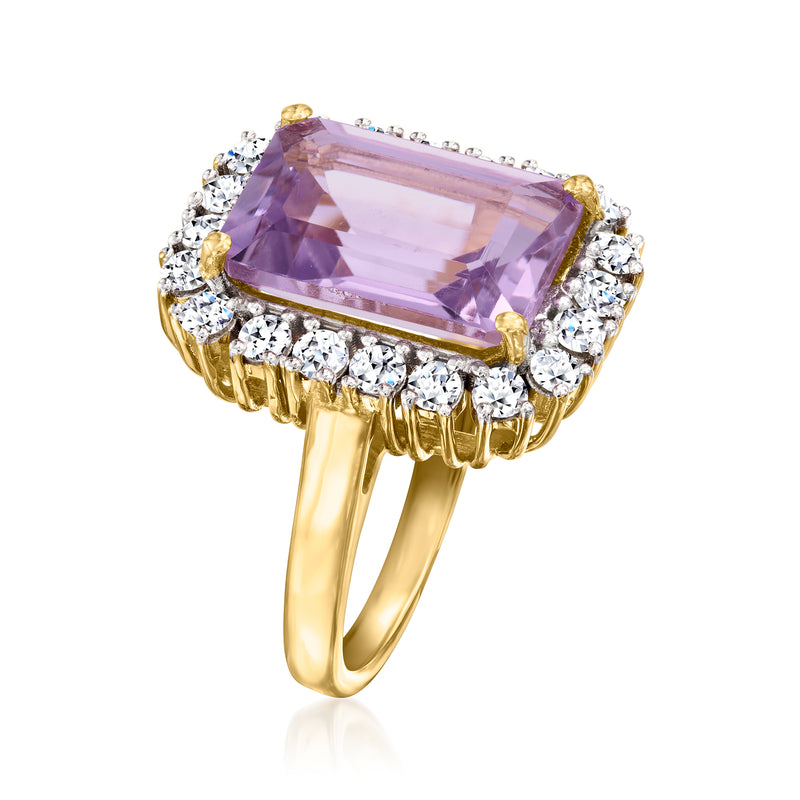 Amethyst cushion-cut ring with gold prongs and diamond halo, angled view