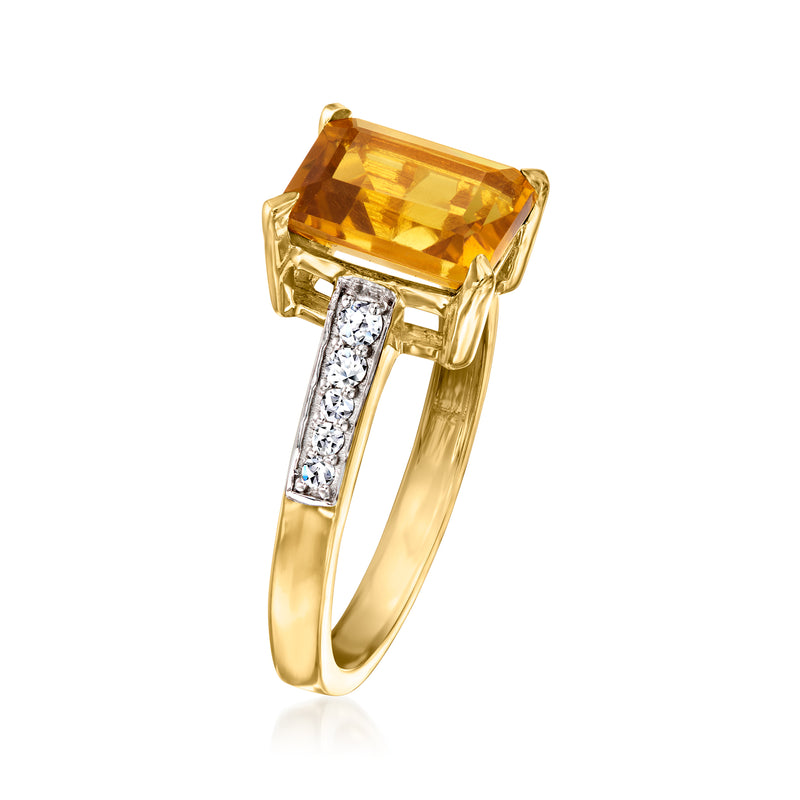 Gold ring with square-cut citrine center stone and diamond bar accents in prongs