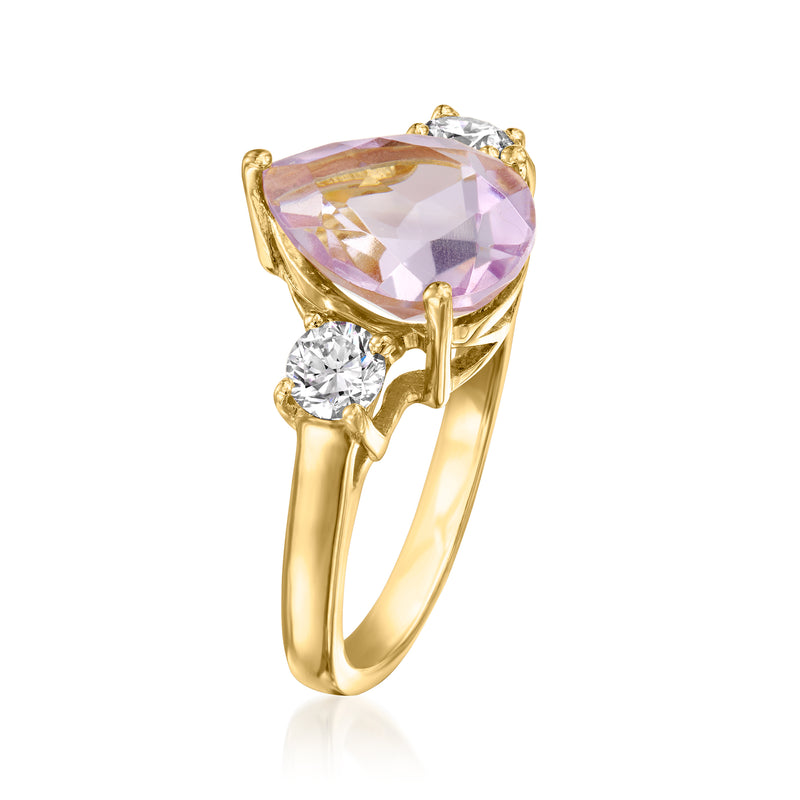 Gold ring with pear-cut amethyst center stone and two round diamond accents