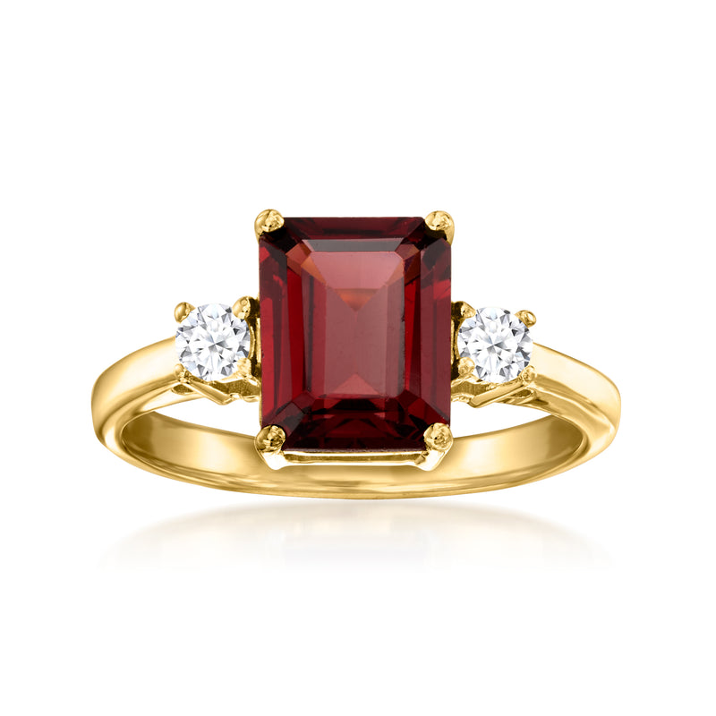 Gold over sterling ring with emerald-cut garnet center and two round diamond accents
