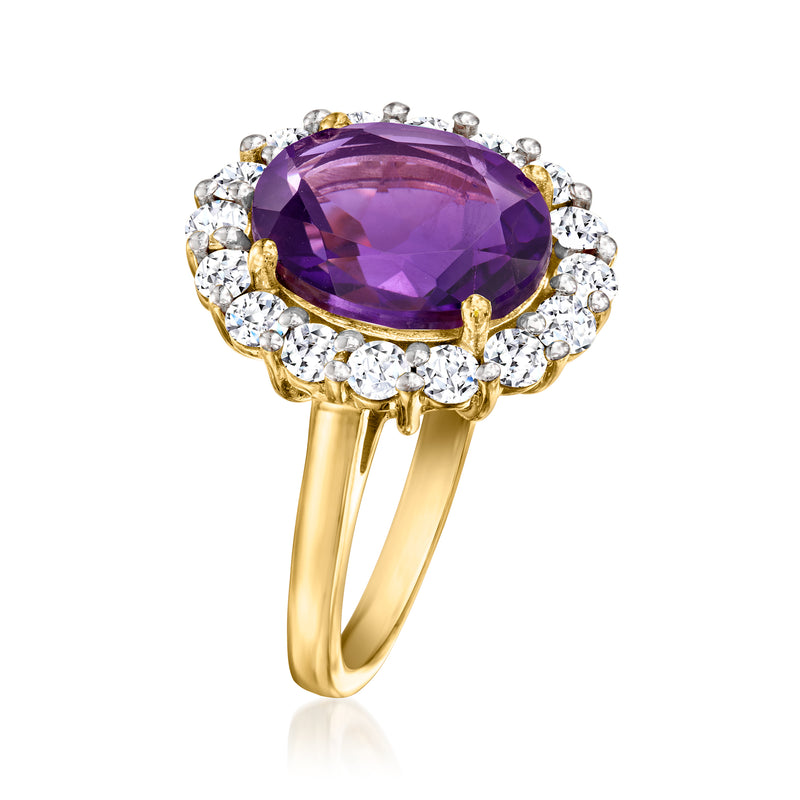 Gold amethyst ring with oval purple gemstone and round diamond halo, open split band