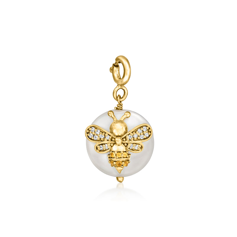 Gold-tone bee charm with round white pearl disc and crystal-studded wings, on hoop bail