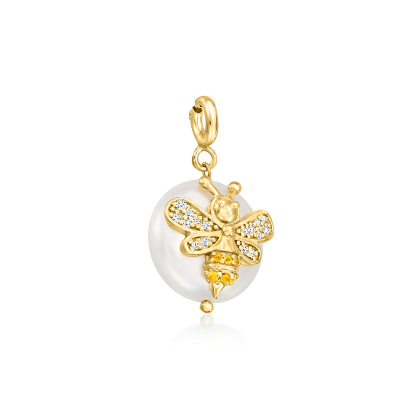 Gold-tone bee charm with round white pearl disc and crystal-studded flowerlike wings, hoop bail