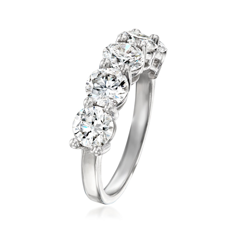 Platinum five-stone lab-grown diamond ring angled view, prong-set three center stones