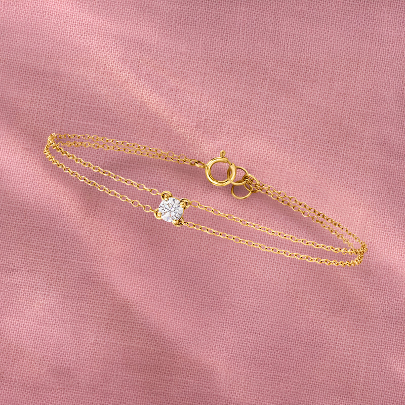 Two-strand 14kt yellow gold bracelet with small round diamond stations and oval clasp
