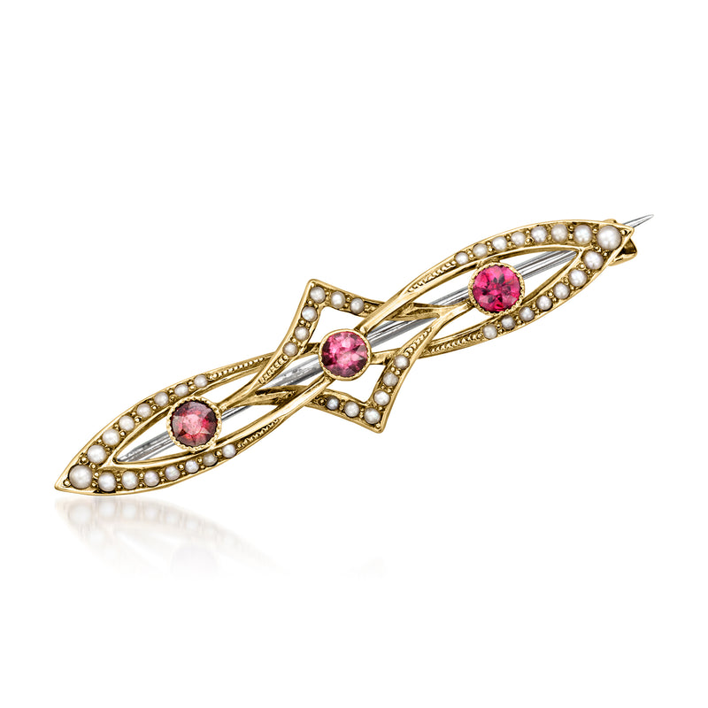 Vintage yellow gold pin with pink garnet stones and seed pearl accents, curved bar design