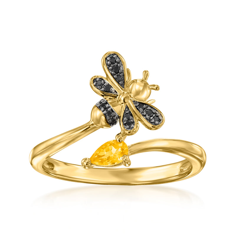 Gold bypass ring with citrine teardrop center and black spinel wing details