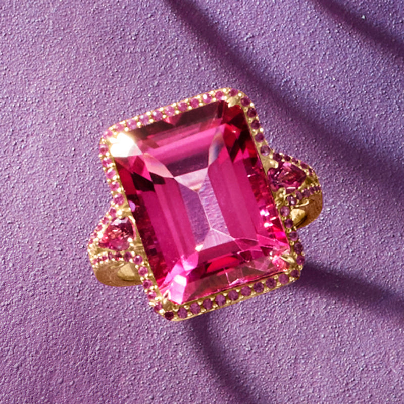 Rose gold emerald-cut pink topaz ring with halo of pink sapphires and prong details