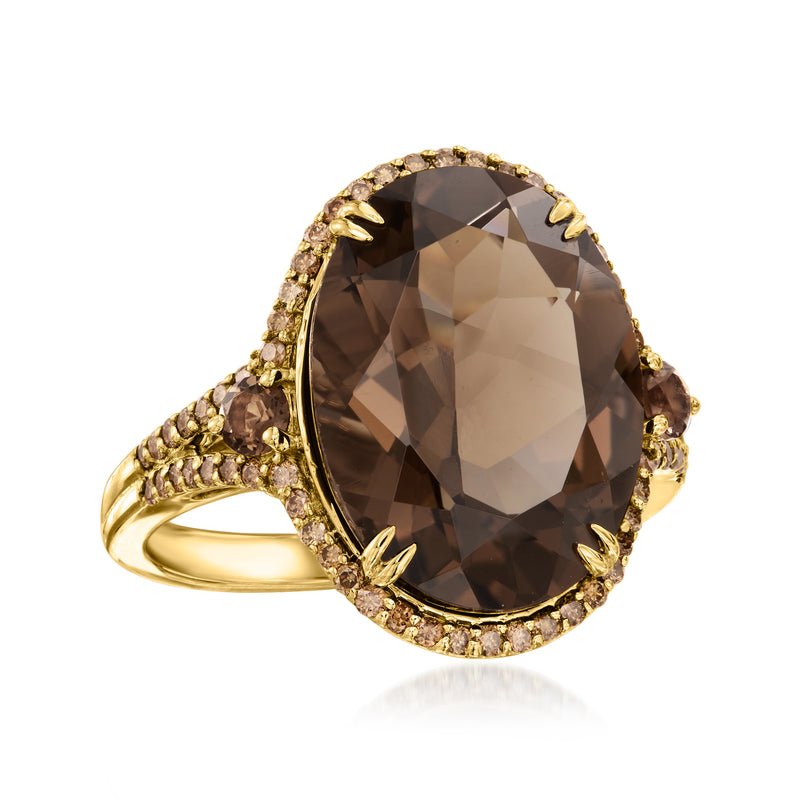 14kt yellow gold ring featuring oval smoky quartz with brown diamond halo
