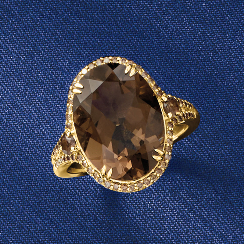 Oval smoky quartz ring in 14kt yellow gold with brown diamond halo detail
