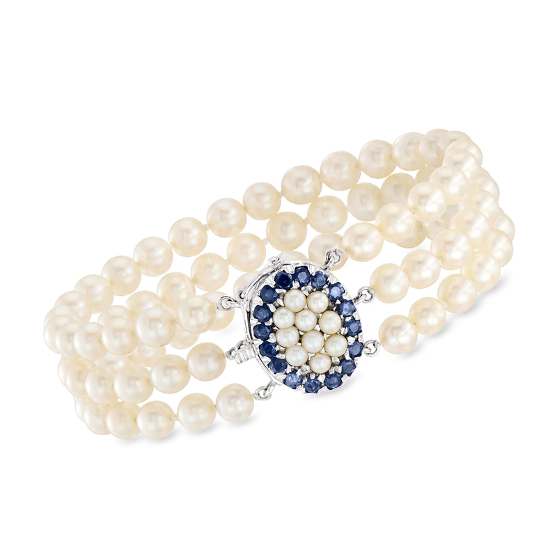 Three-row cultured pearl bracelet with round blue sapphire cluster clasp in white gold