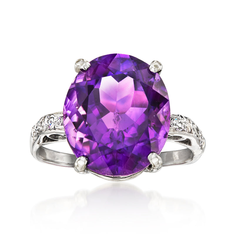 Oval amethyst ring with diamond accents, set in platinum and split prongs