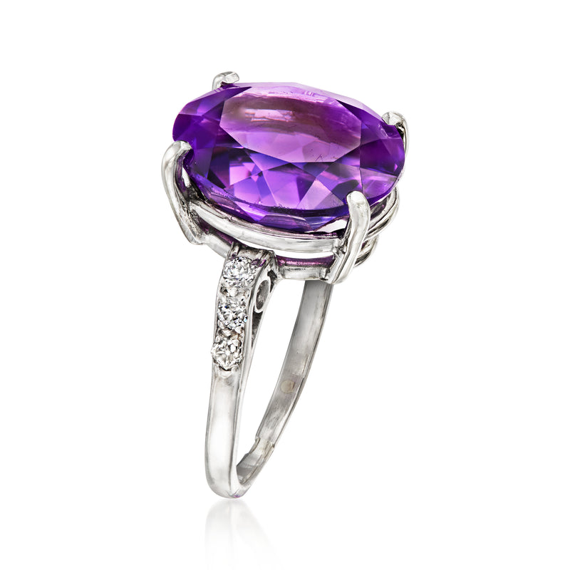 Side view of oval amethyst ring with diamond halo and prong setting on platinum band