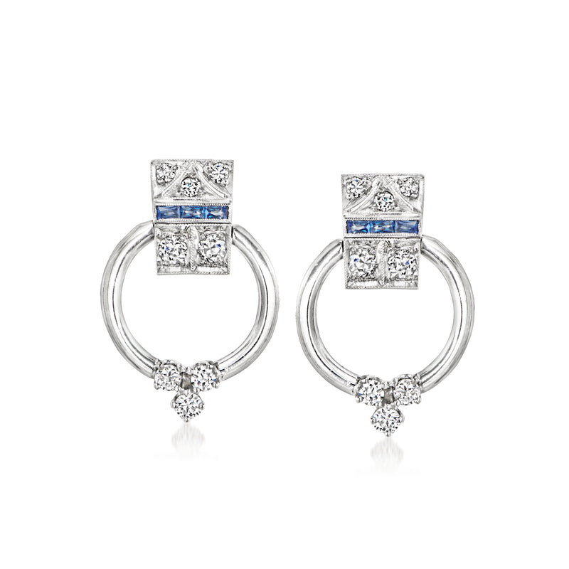 Platinum and 14kt white gold doorknocker hoop earrings with blue sapphire and diamond accents