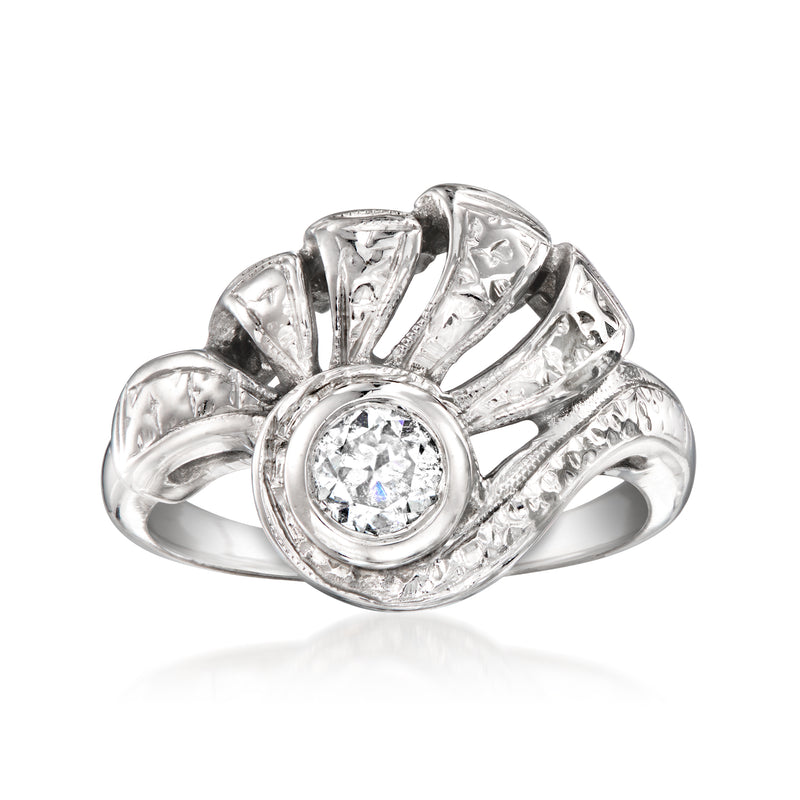 Vintage swirl diamond ring in white gold, round center stone with arched halo