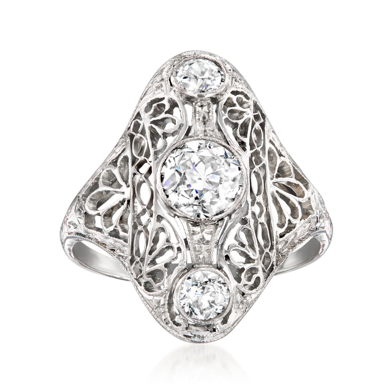 Vintage diamond dinner ring in 14k white gold with three round brilliant diamonds