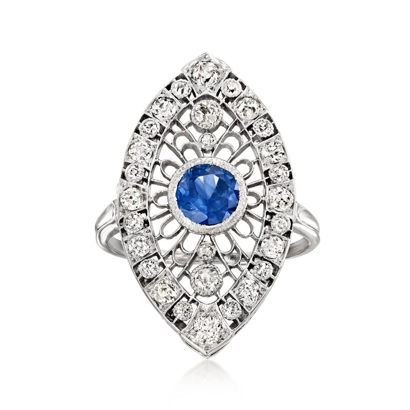 Sapphire blue oval navette ring with diamond halo in polished platinum