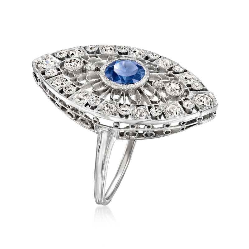 Platinum navette ring with sapphire center and diamond accents