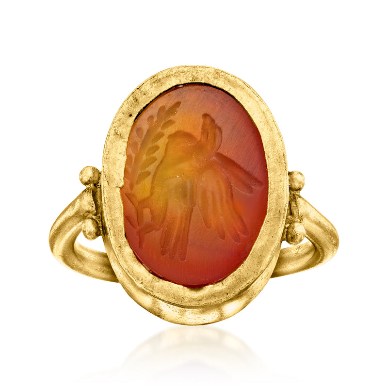 Oval carnelian bird intaglio ring in 20kt yellow gold, domed bezel setting