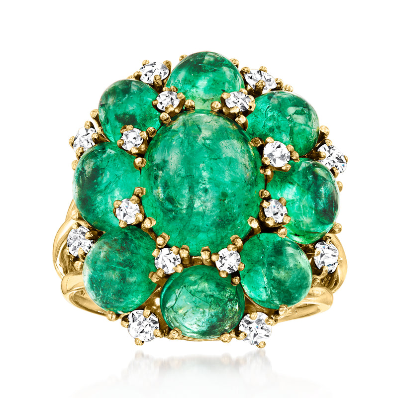 Vintage emerald cluster ring in 14kt yellow gold with oval green stones and diamond accents