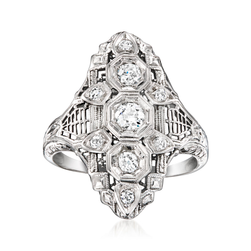 Vintage diamond filigree dinner ring in 18kt white gold with center and side stones