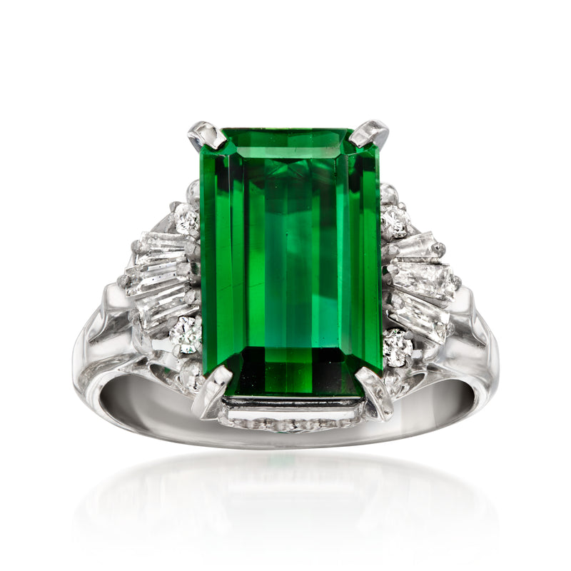 Platinum ring with emerald-cut green tourmaline and baguette diamond halo