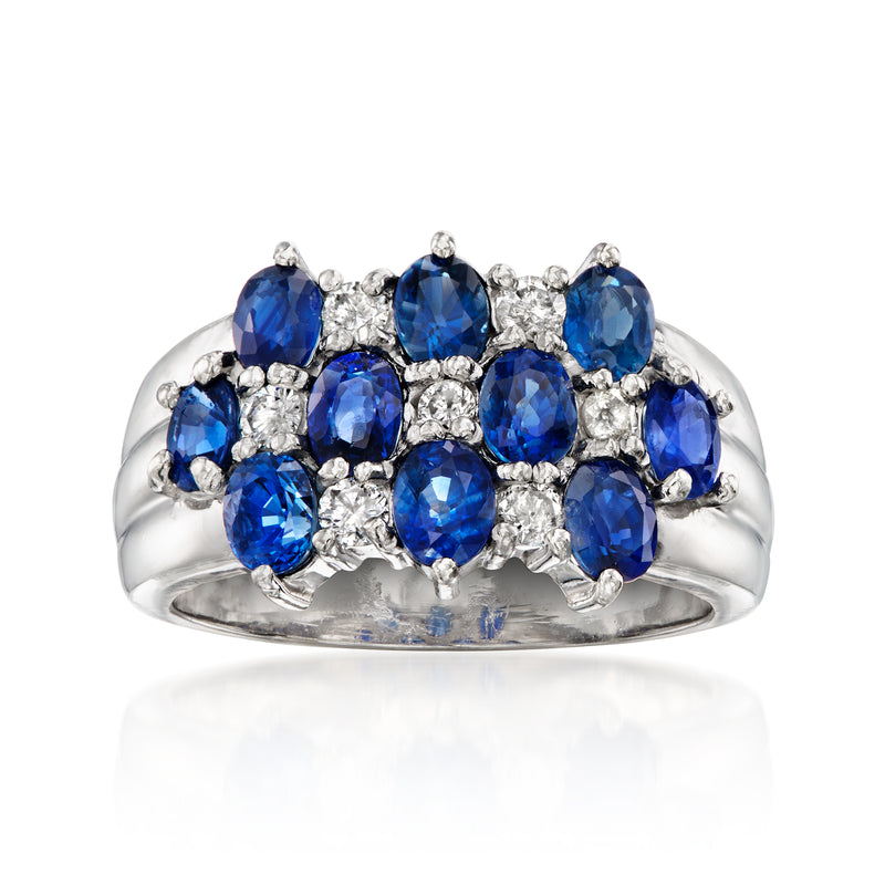 Platinum three-row gemstone ring with oval blue sapphires and round white diamonds