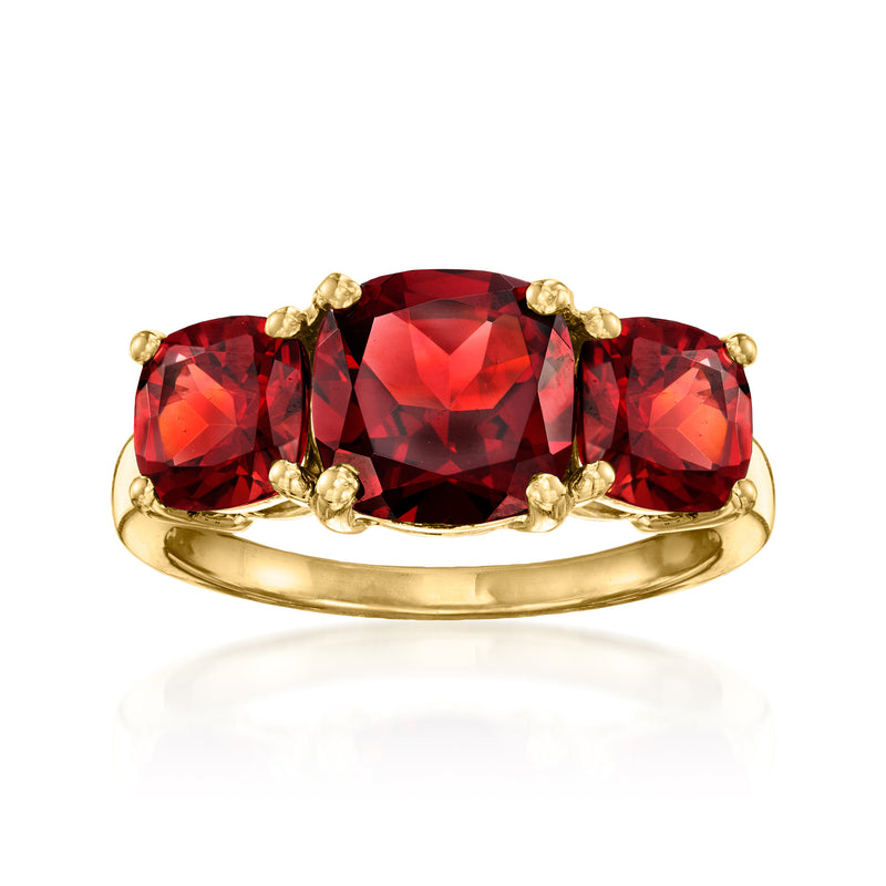 18kt gold over sterling garnet three-stone ring with three red gemstones