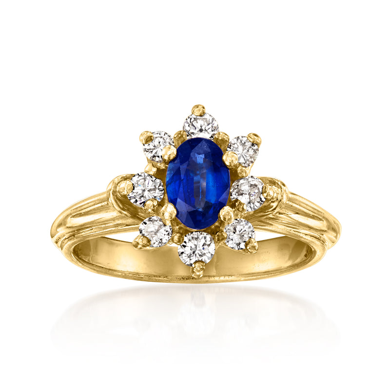 Vintage 14kt yellow gold ring with oval blue sapphire and round diamond halo