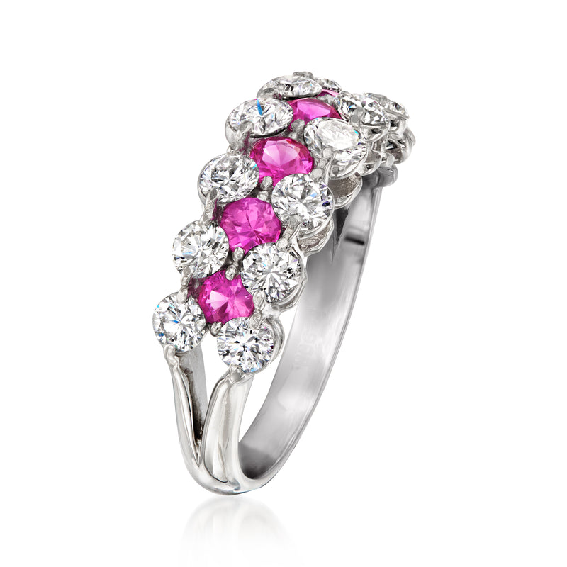Platinum diamond ring featuring a cluster of pink sapphires in ornate settings