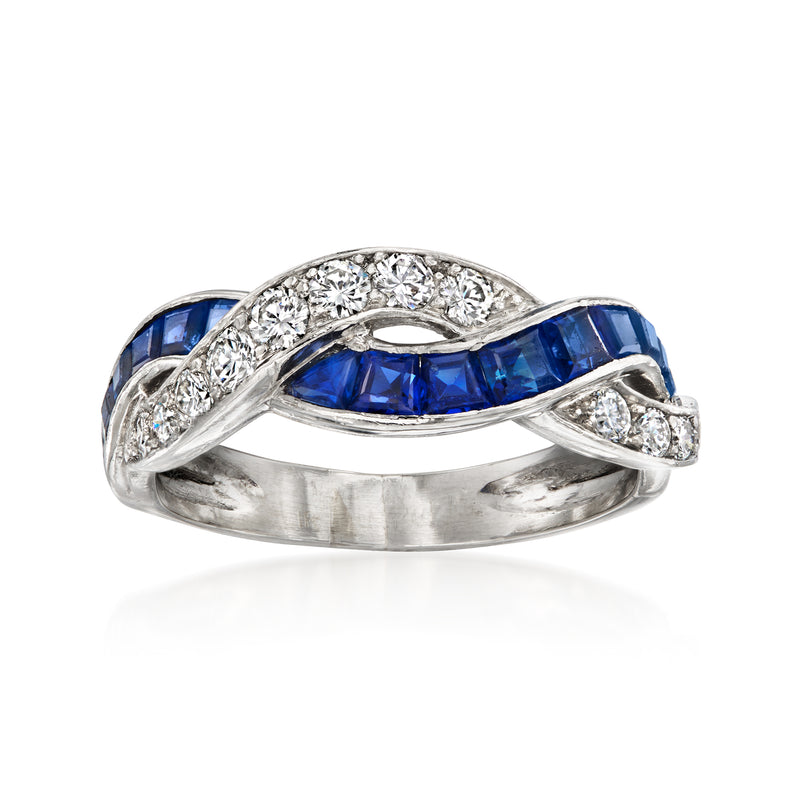 Vintage platinum twisted ring with blue sapphire center and diamond accents