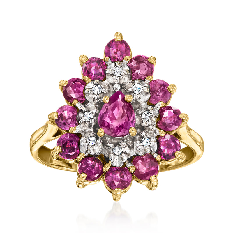 Vintage yellow gold ruby cluster ring with diamond accents and central pink oval stone