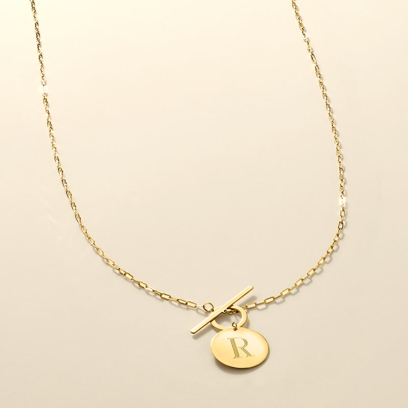 14kt yellow gold link necklace with round R disc charm and toggle clasp